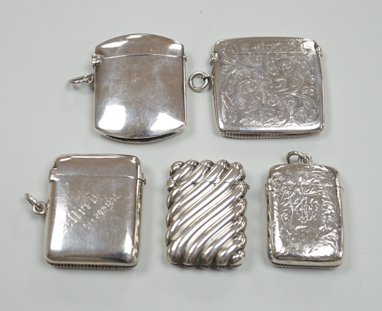 Five assorted late Victorian/Edwardian silver vesta cases, largest 46mm.